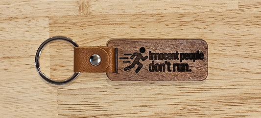 Innocent People Don’t Run Wooden Keyring